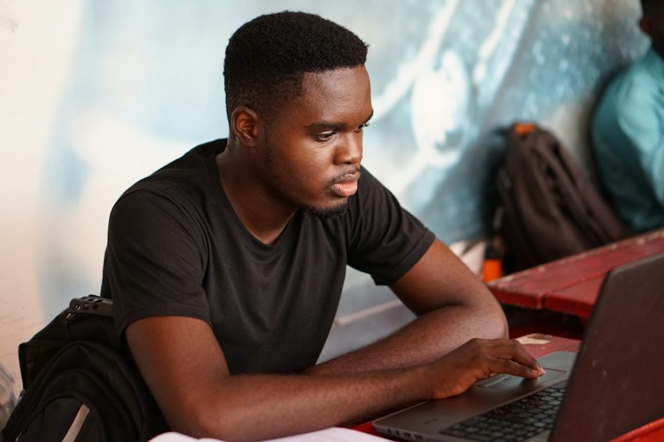 Working at a laptop in an education office